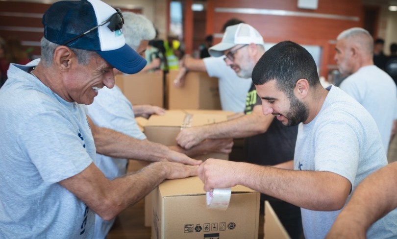 Volunteers unpacking donations for displaced residents of Israel's south